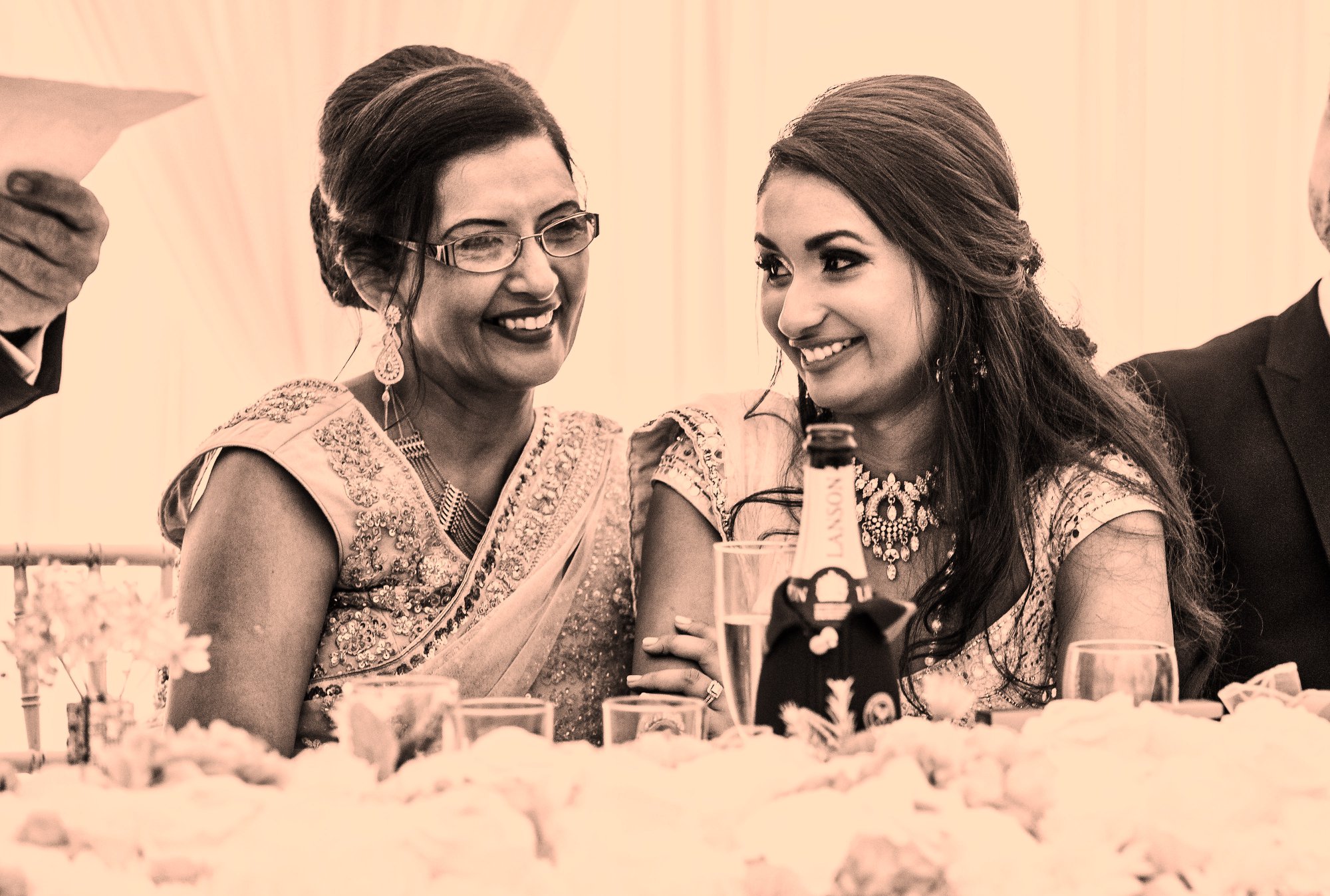 Divpreet and her mother at her wedding, laughing together